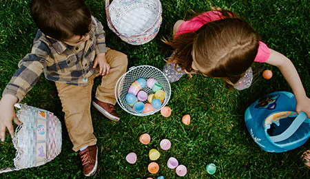 Children gather Easter eggs.